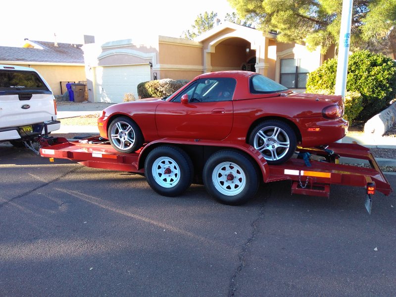 Illustration for article titled A frosty Miata upon its sleigh awaits the journey home.